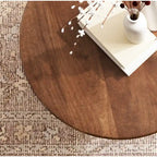 Table basse ronde, noyer marron et or, plateau en bois et piètement en métal